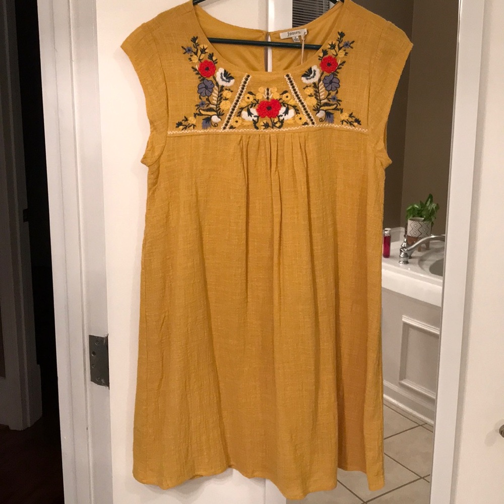 Yellow dress with floral embroidery
